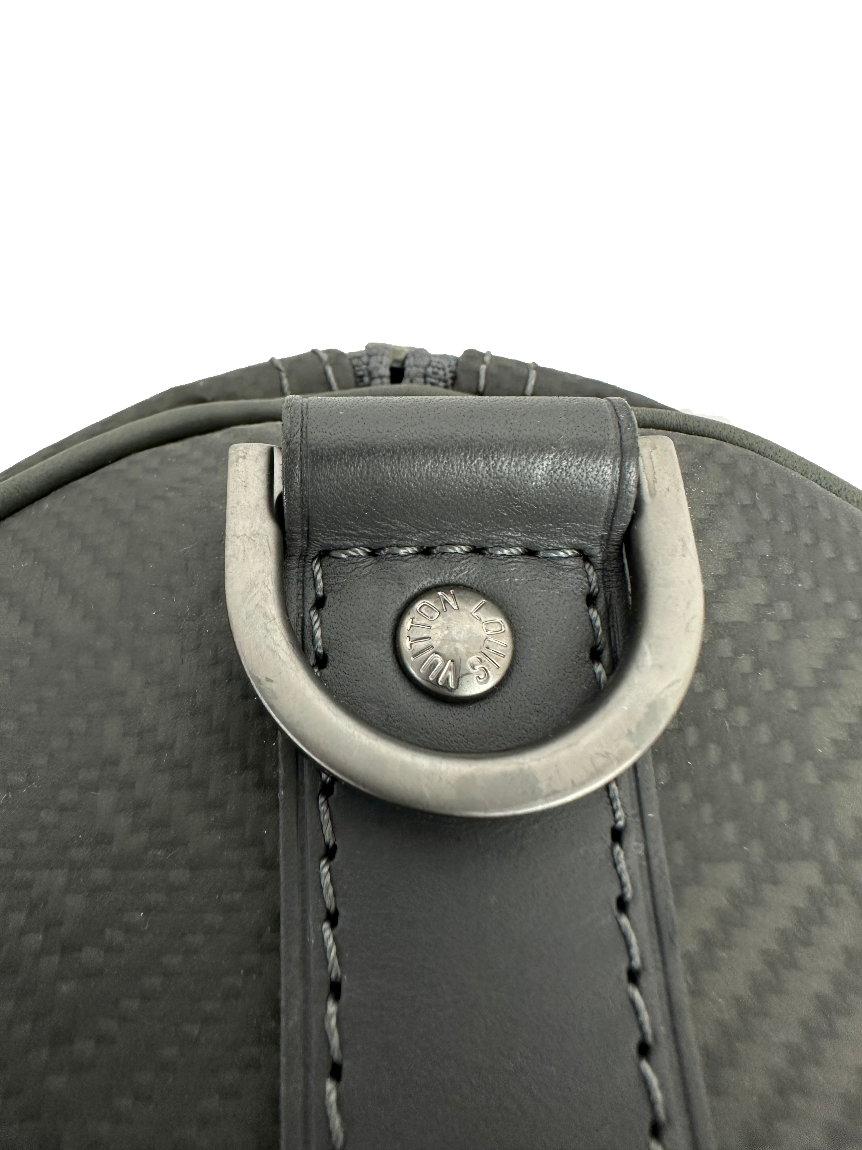 Louis Vuitton Keepall 45 in damier carbone with leather trim