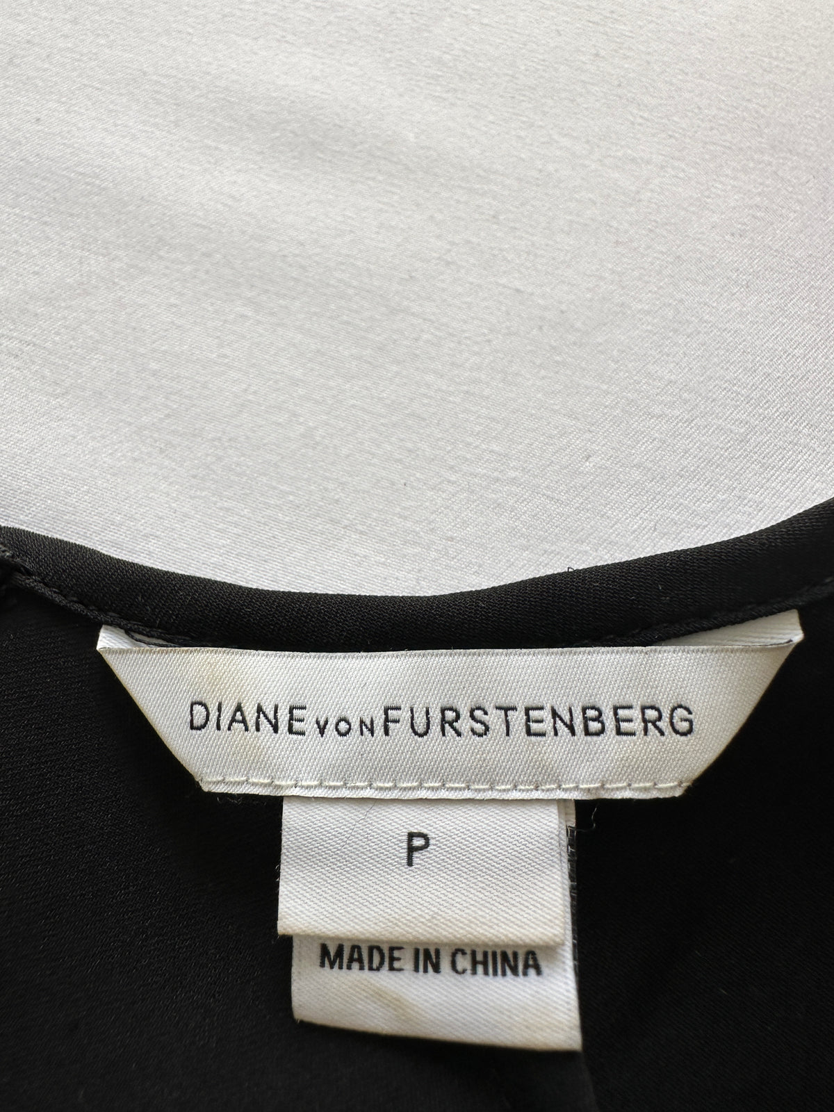 Diane Von Furstenberg black top with blue pile dot detail on front - size 36