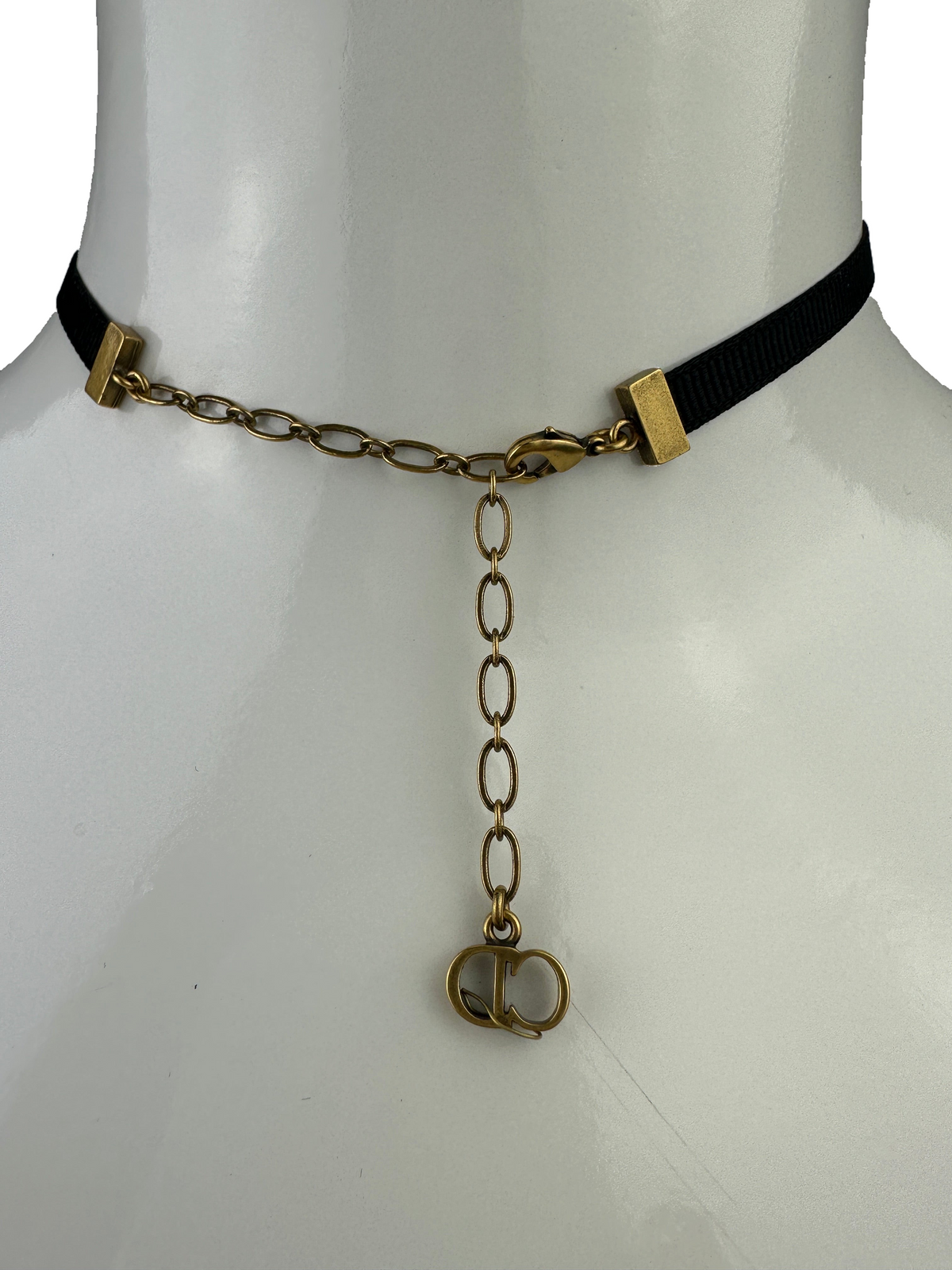 Black choker with "Dior" inscription